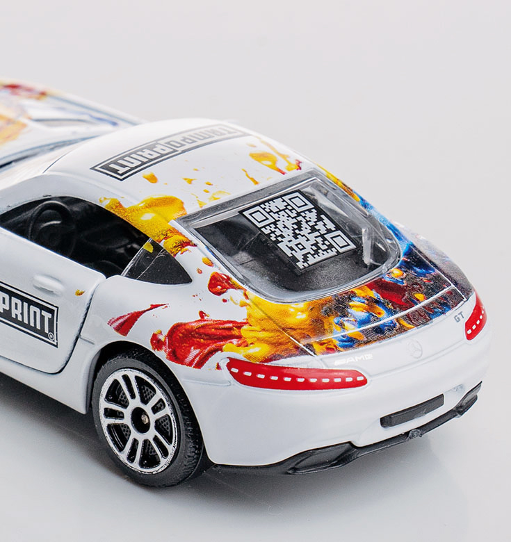 Lasermarkierung Farbabtrag auf Spielzeugauto.